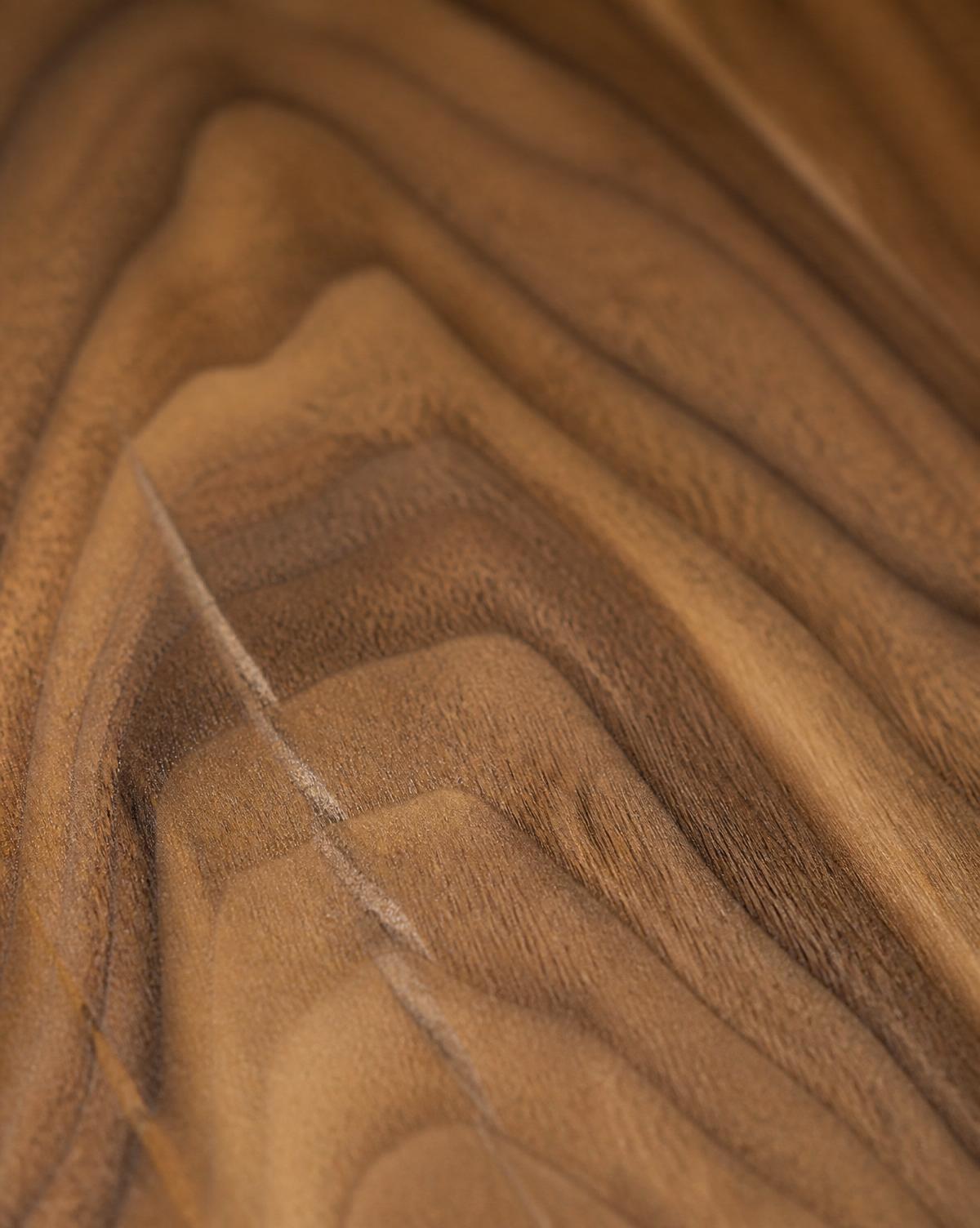 Macro detail of walnut veneer grain catching warm daylight